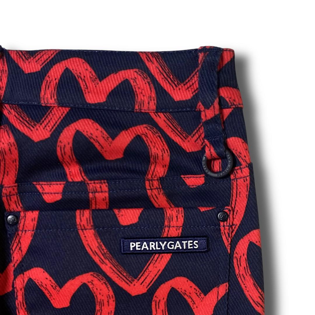 定31900円 1 パーリーゲイツ 落書きハート柄 ストレッチ ロングパンツ 紺